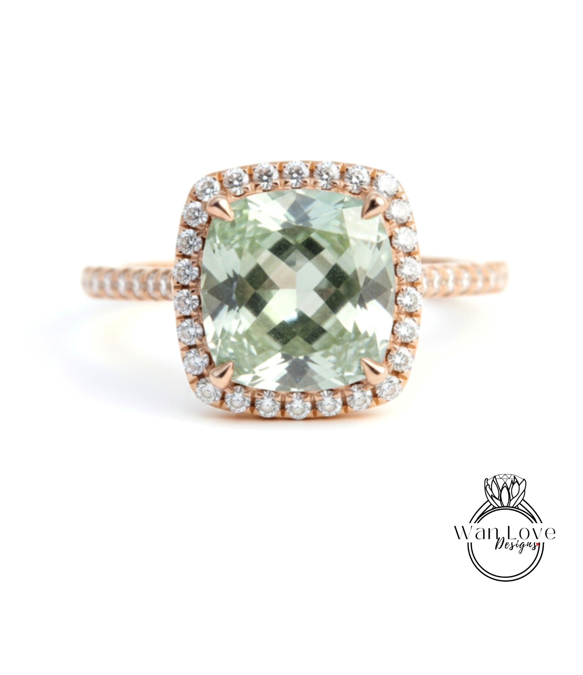 A ring featuring a large, square-cut green gemstone surrounded by a halo of smaller diamonds set in a rose gold band.