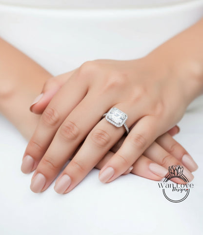 A close-up of a person's hand wearing a large diamond engagement ring.