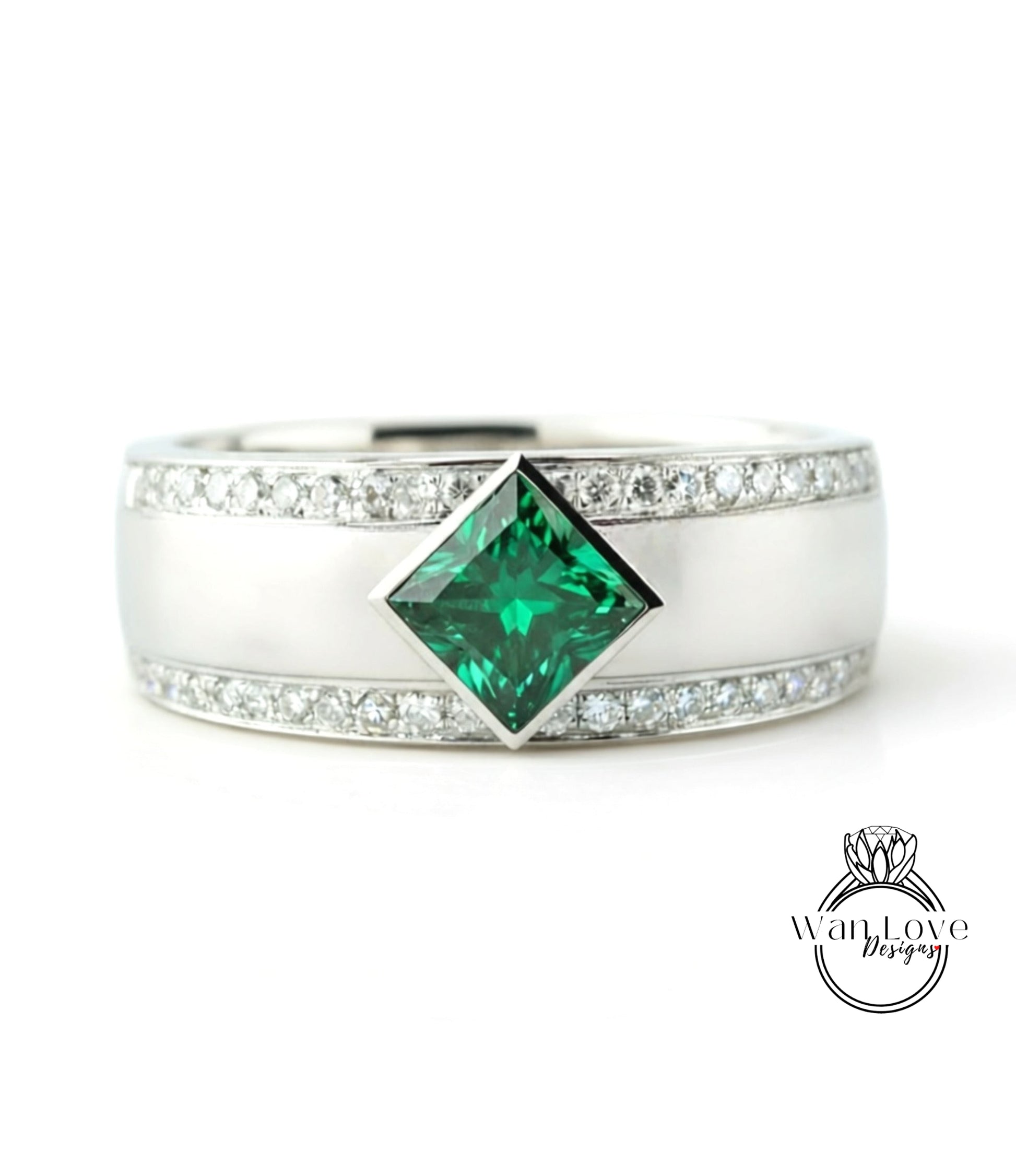 A silver ring with a large green gemstone in the center, surrounded by smaller diamonds.