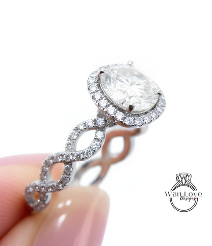 A close-up of a diamond engagement ring being held in someone's hand, showcasing the intricate design and sparkling diamond.