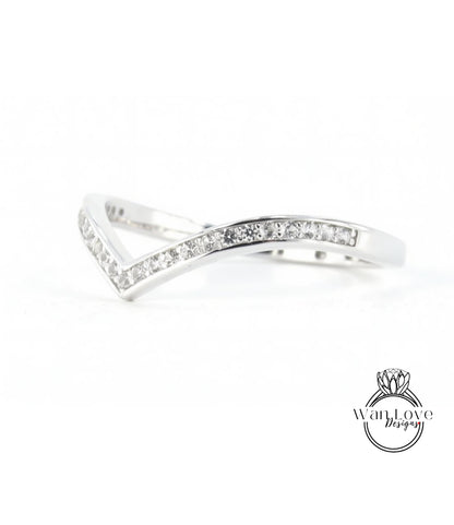 A silver ring with a diamond-encrusted band.
