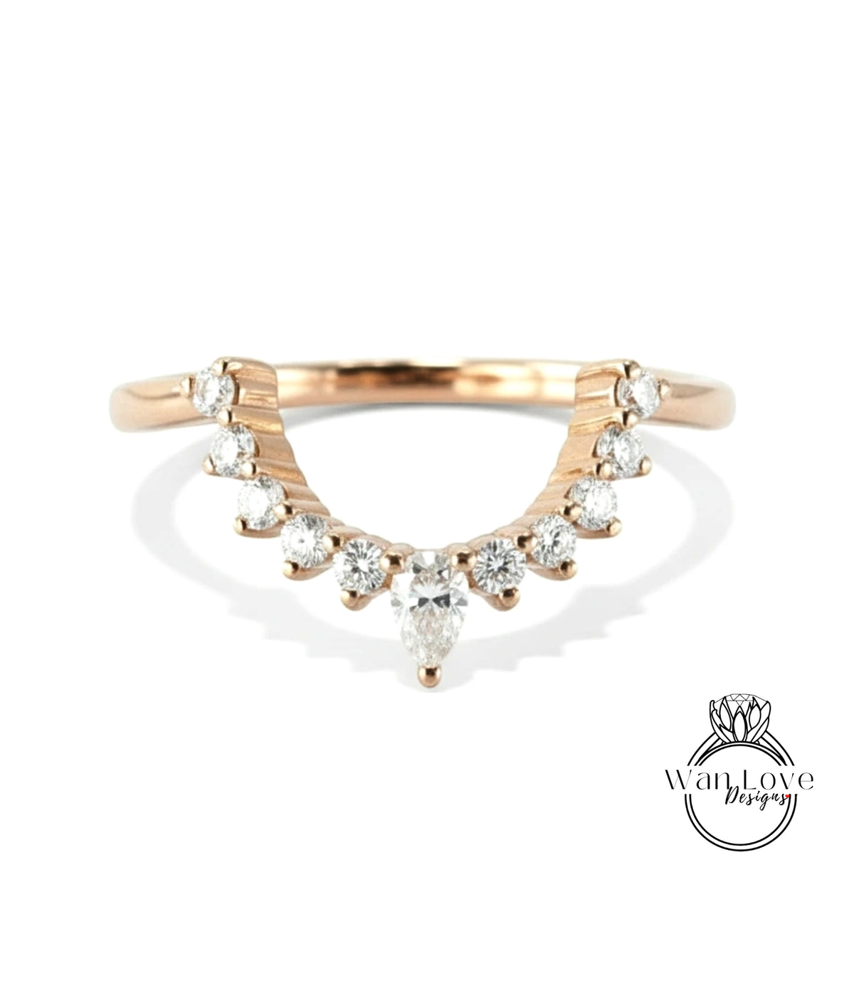 A rose gold ring with a large central diamond and smaller diamonds arranged in a decorative pattern around the band.