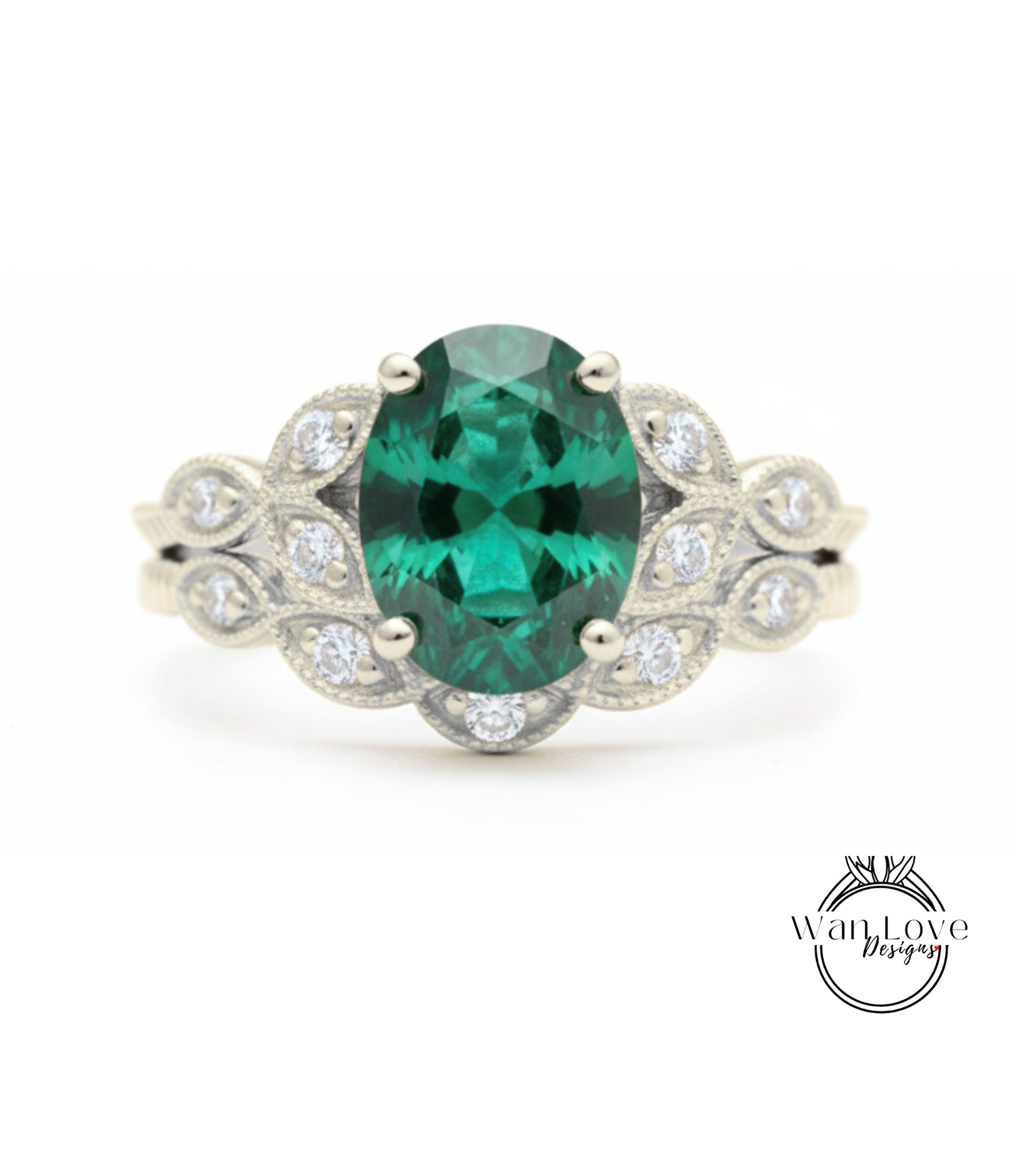 A silver ring with a large oval-shaped green gemstone surrounded by smaller diamonds.