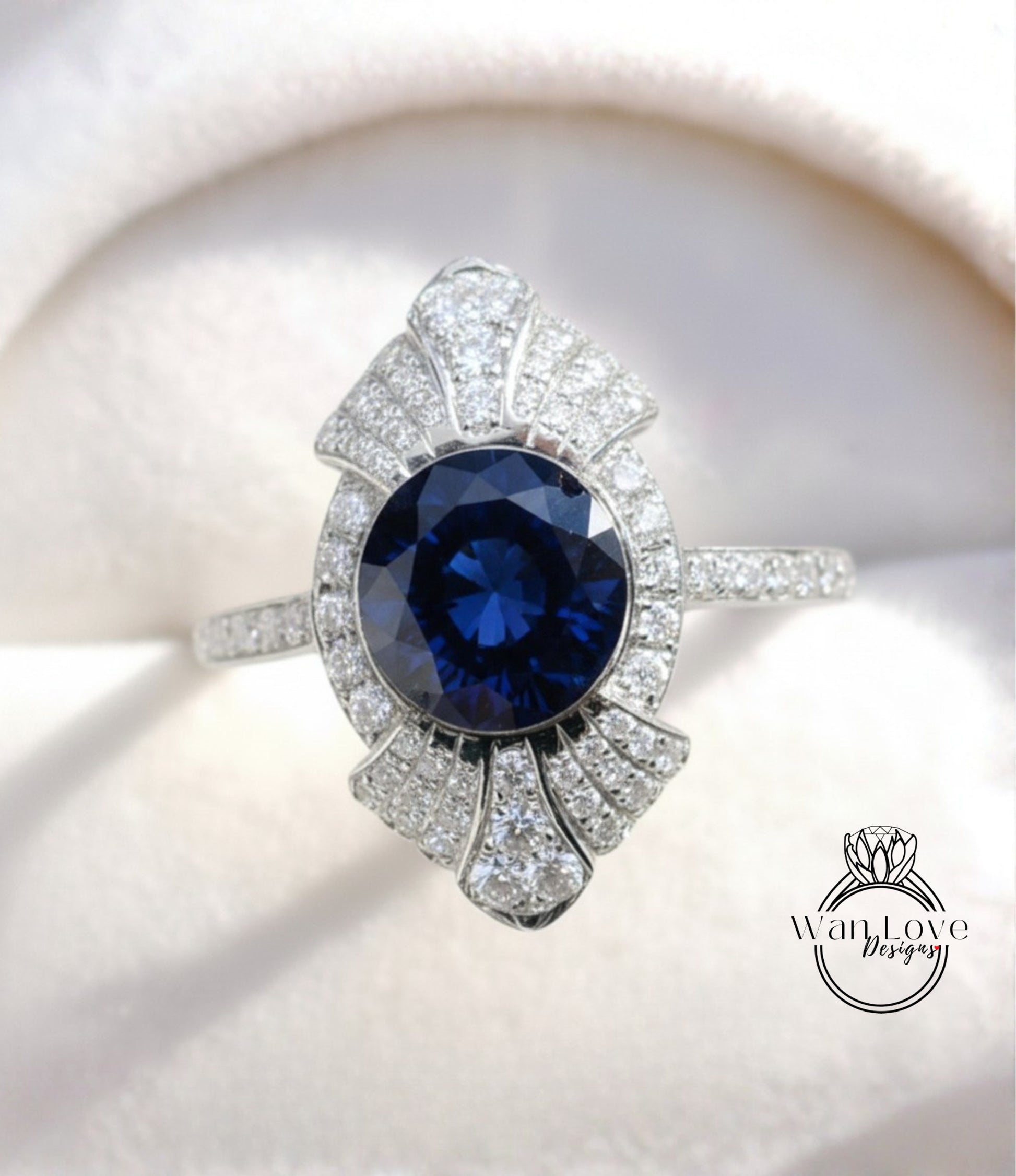 A close-up image of a diamond ring with a large blue gemstone set in a silver band.