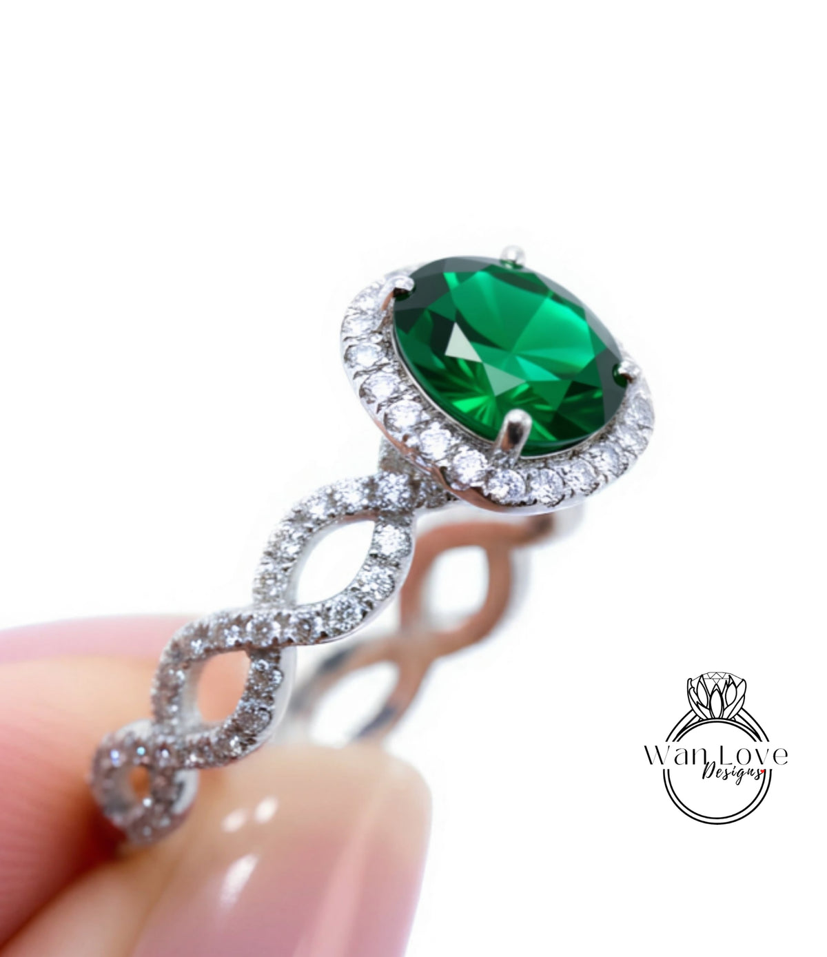A close-up of a silver ring with a large, green gemstone set in the center, surrounded by smaller diamonds.