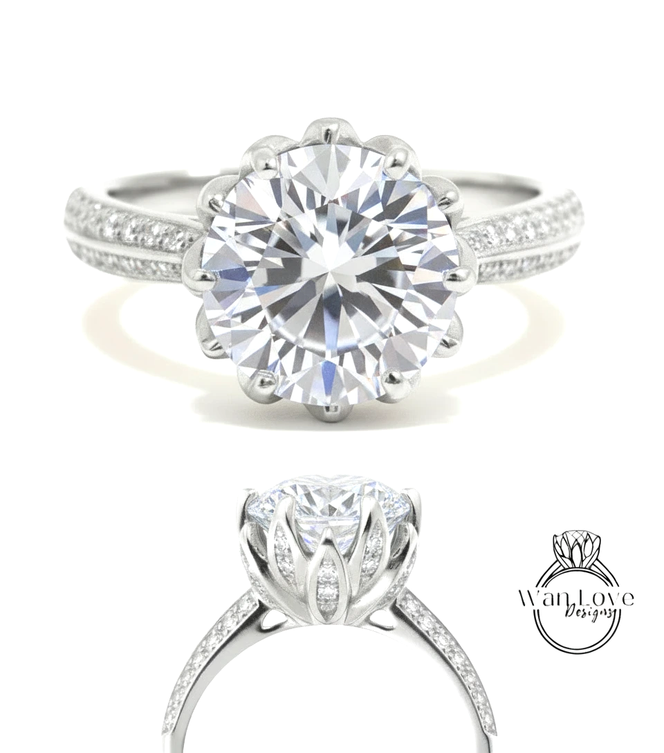 A stunning diamond engagement ring with a large round brilliant cut diamond set in a silver band adorned with small diamonds.