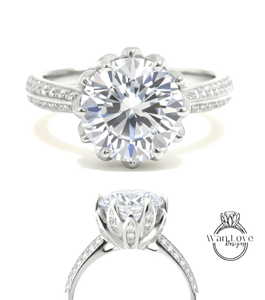 A stunning diamond engagement ring with a large round brilliant cut diamond set in a silver band adorned with small diamonds.