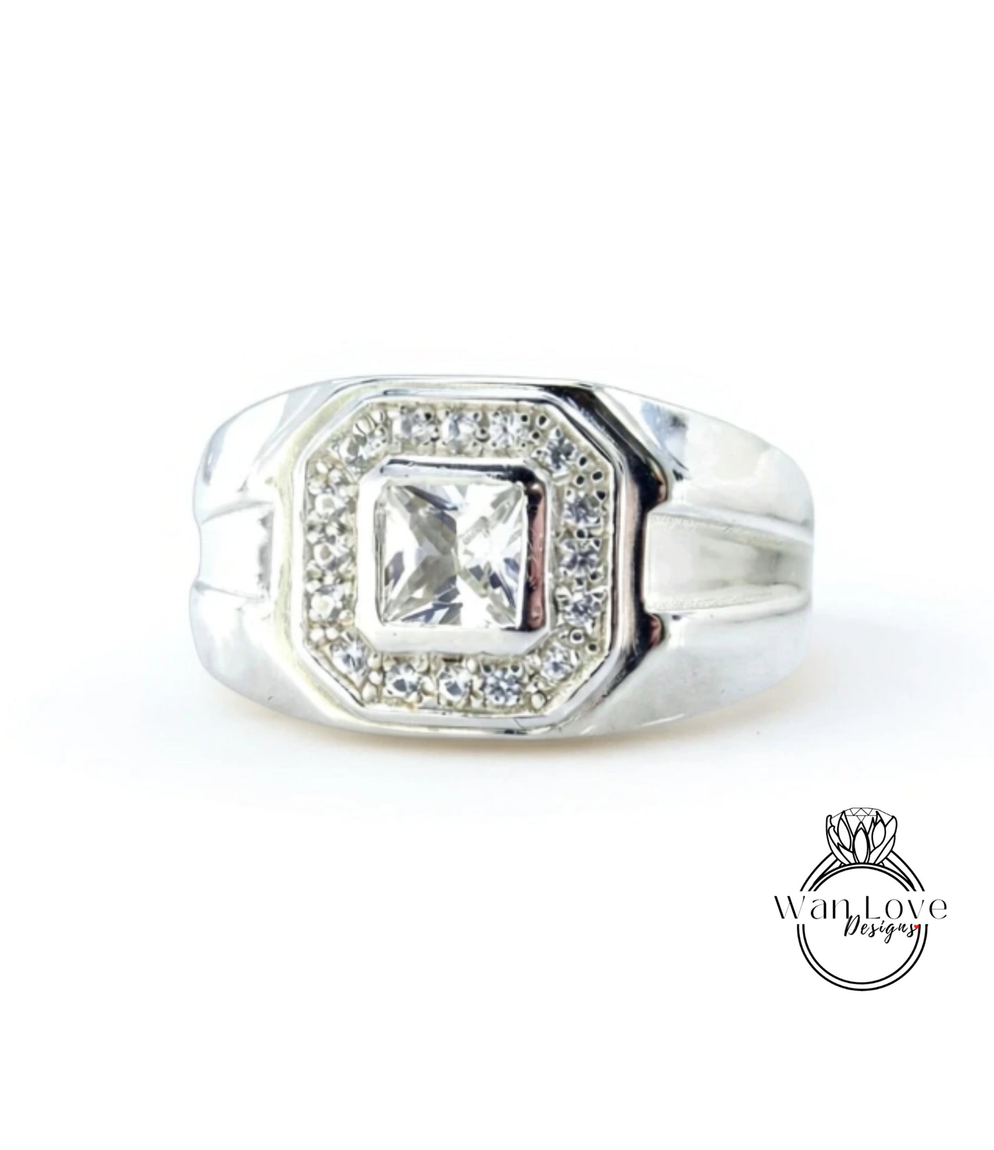 A silver ring with a large central diamond surrounded by smaller diamonds.