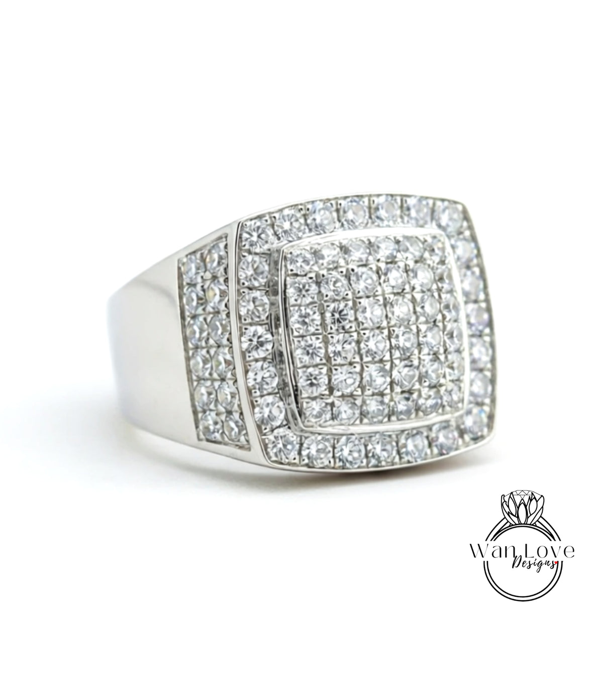 A silver ring with a large diamond-encrusted square in the center.