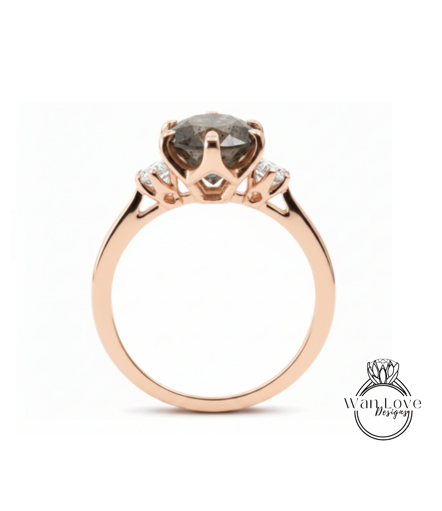 A rose gold engagement ring with a large, dark grey diamond as the centerpiece, set in a three-pronged design.