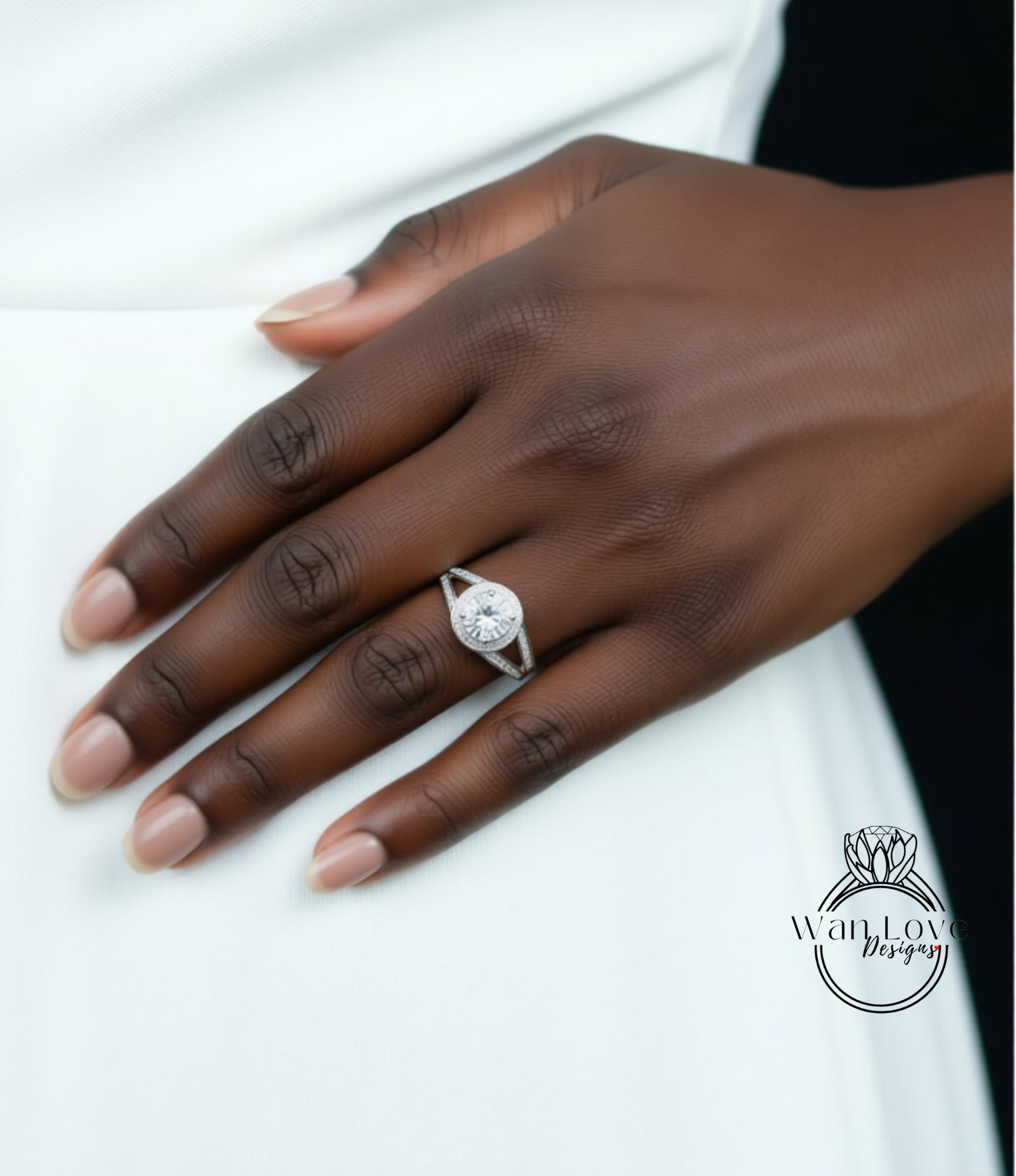 A close-up of a hand wearing a diamond engagement ring.