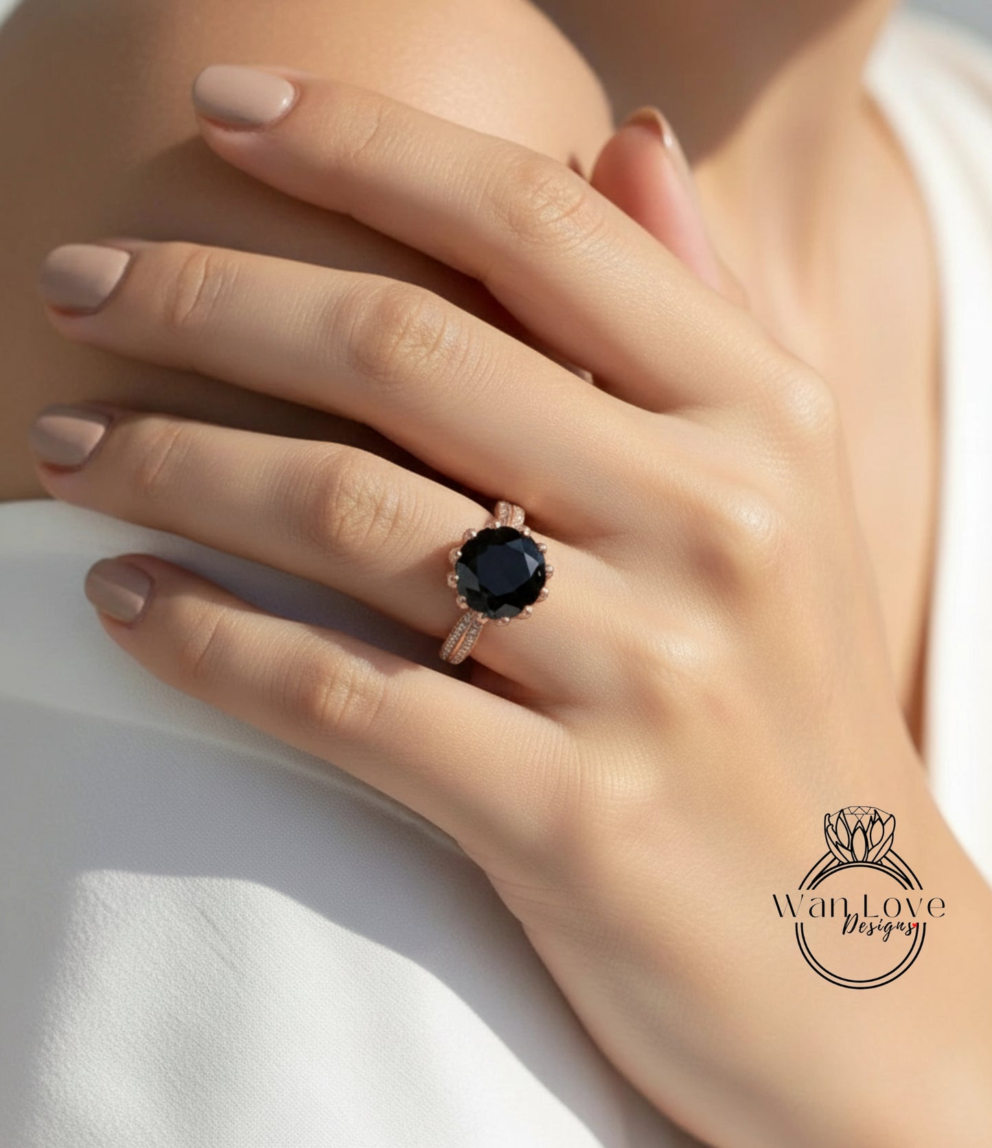 A close-up of a person's hand wearing a large, dark-colored diamond ring.