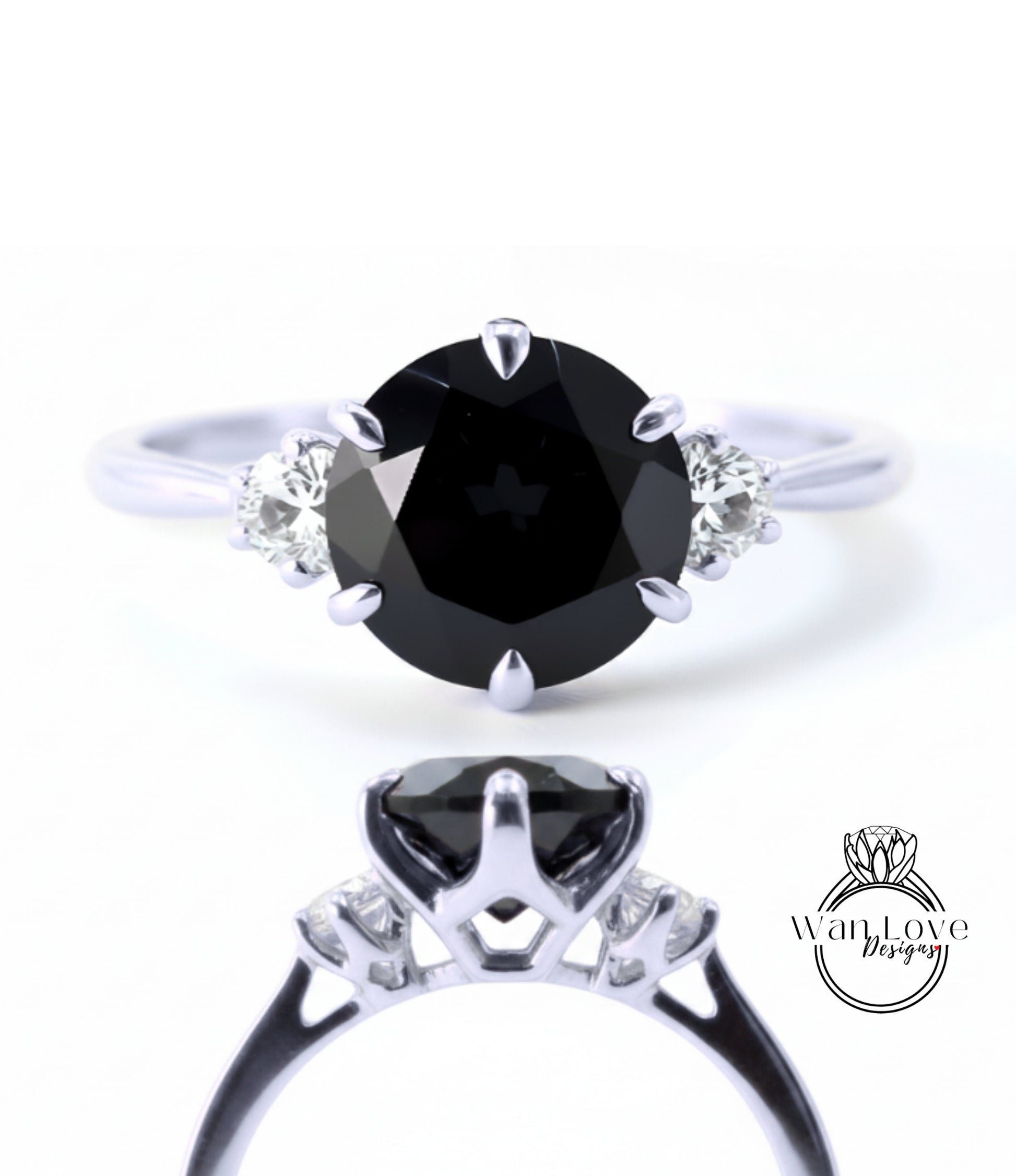 a silver ring with a large black diamond as the centerpiece. The ring has a unique design with three smaller diamonds on either side of the large black diamond.