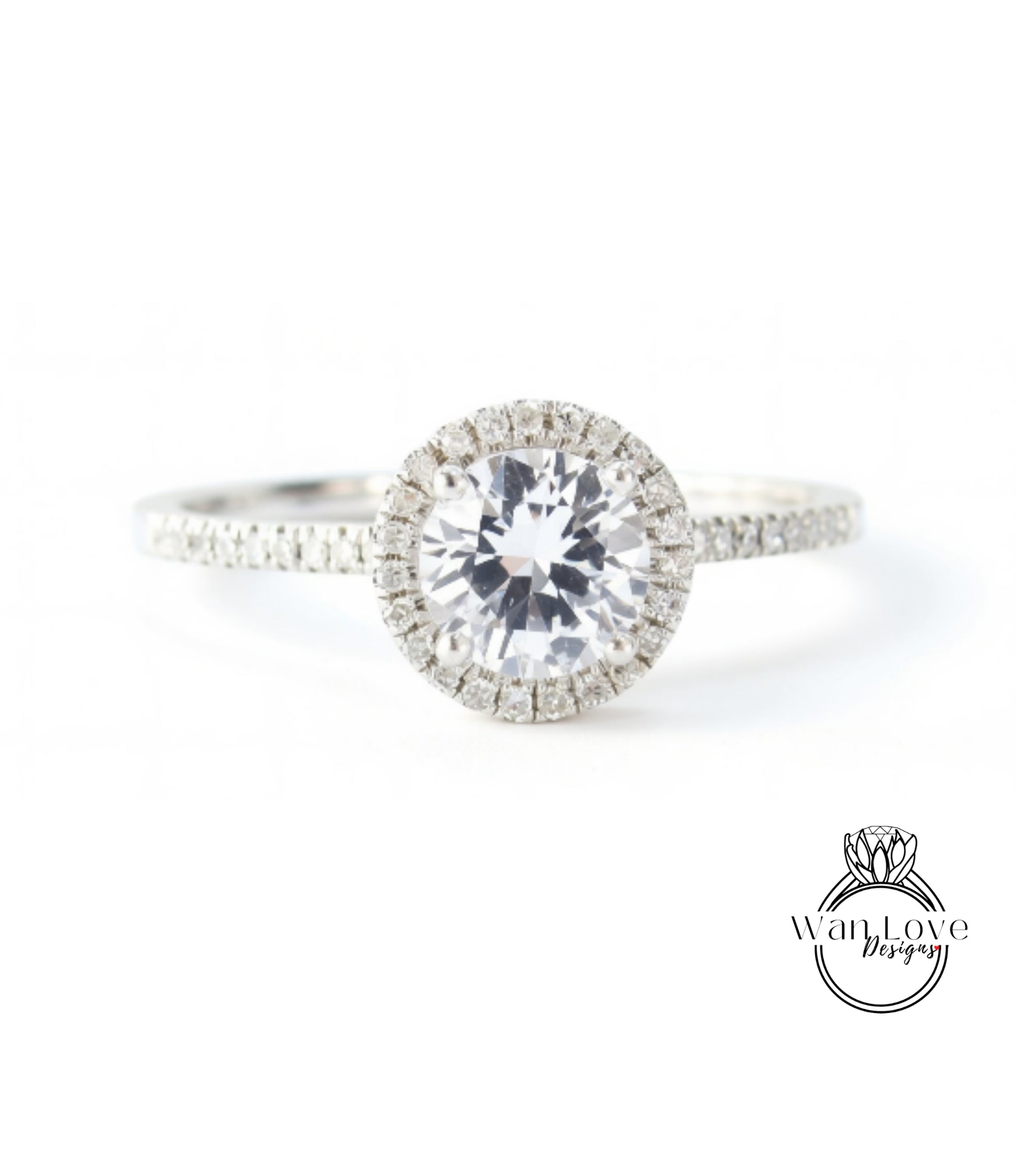 A close-up view of a diamond engagement ring with a large central diamond surrounded by smaller diamonds on the band.