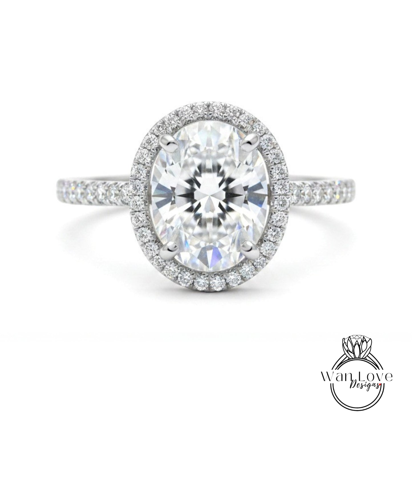 A stunning diamond engagement ring with a large oval-shaped diamond set in a halo of smaller diamonds, surrounded by a band of smaller diamonds.