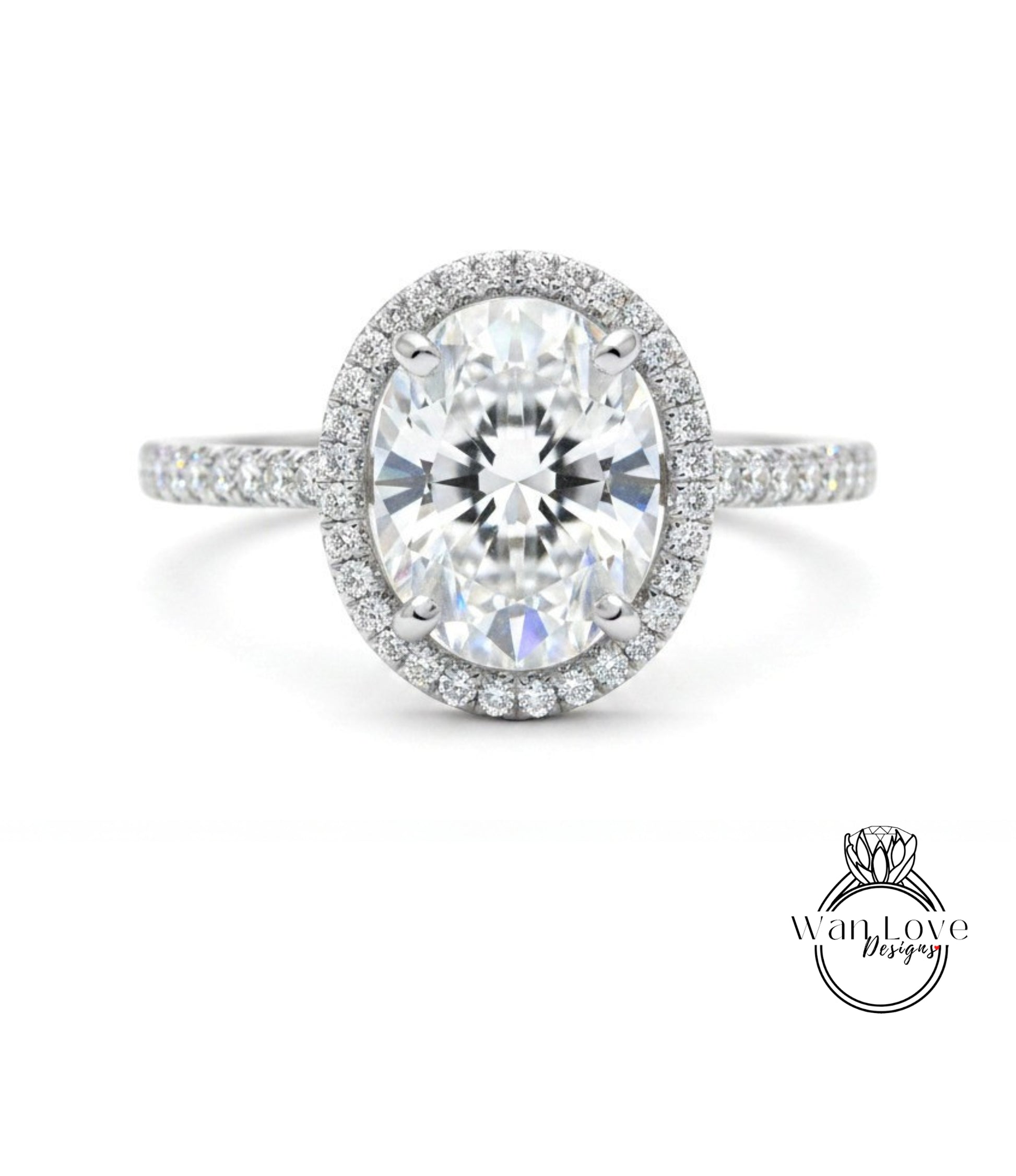 A stunning diamond engagement ring with a large oval-shaped diamond set in a halo of smaller diamonds, surrounded by a band of smaller diamonds.