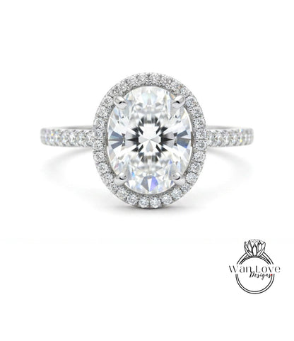 A stunning diamond engagement ring with a large oval-shaped diamond set in a halo of smaller diamonds, surrounded by a band of smaller diamonds.