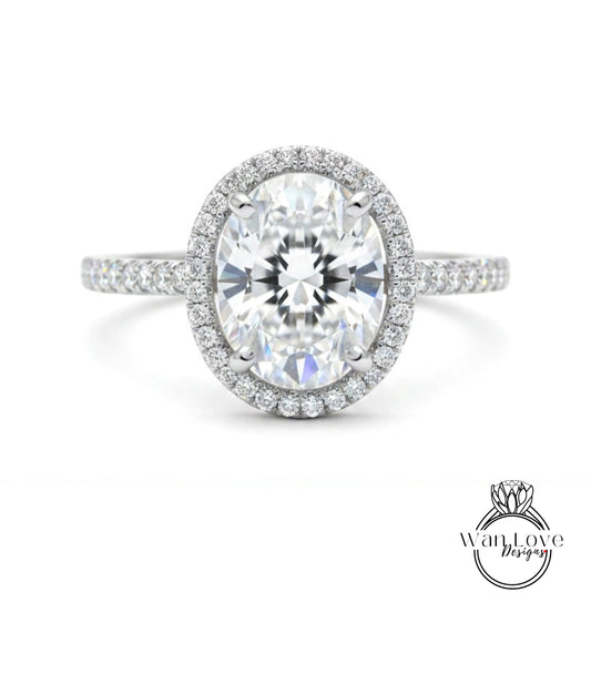 A stunning diamond engagement ring with a large oval-shaped diamond set in a halo of smaller diamonds, surrounded by a band of smaller diamonds.