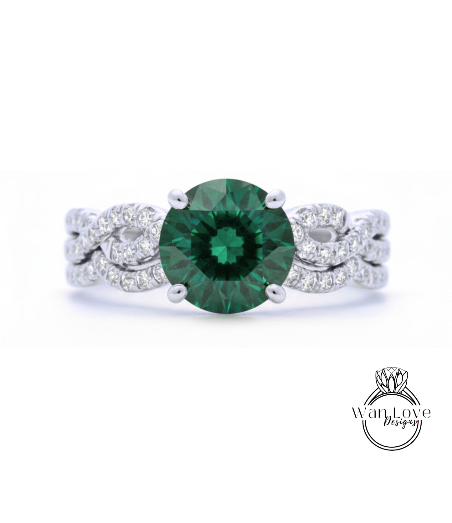 A close-up of a silver ring with a large, green gemstone at the center.