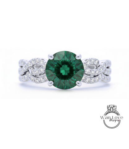 A close-up of a silver ring with a large, green gemstone at the center.