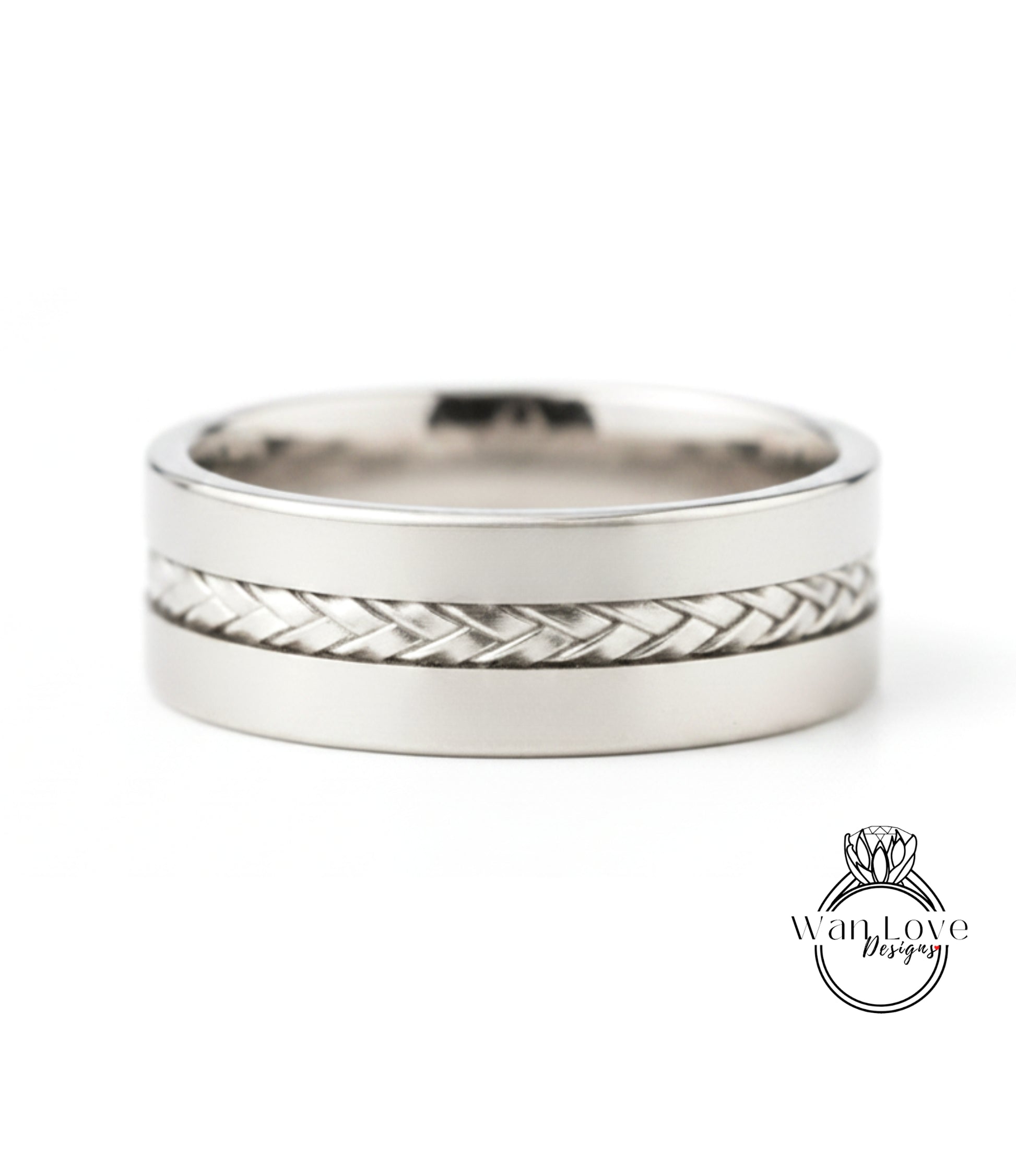 A silver-colored ring with a braided band design.
