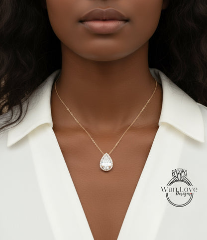 A close-up of a woman's neck and chest area wearing a gold necklace with a large, sparkling diamond pendant.