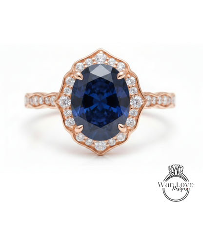 a beautiful rose gold ring with a large oval-shaped blue gemstone set in the center, surrounded by smaller diamonds.