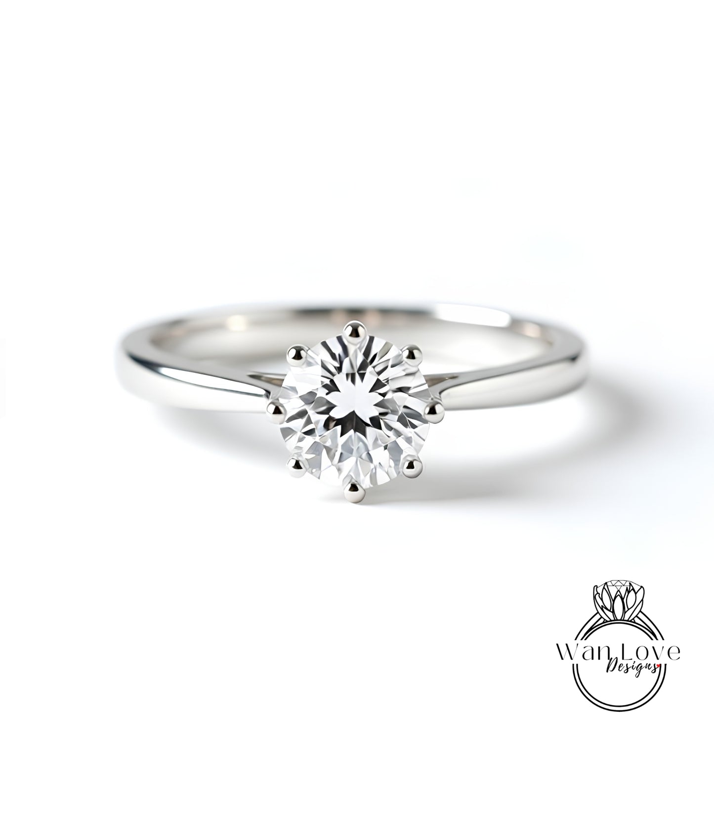 A close-up of a diamond engagement ring with a large central diamond surrounded by smaller diamonds.
