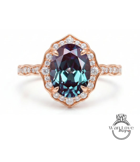 a beautiful ring with a large oval-shaped gemstone set in a rose gold band, surrounded by smaller diamonds.