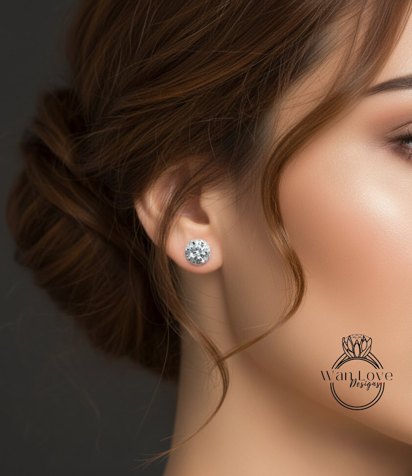A close-up of a woman's face, focusing on her earrings and hair.