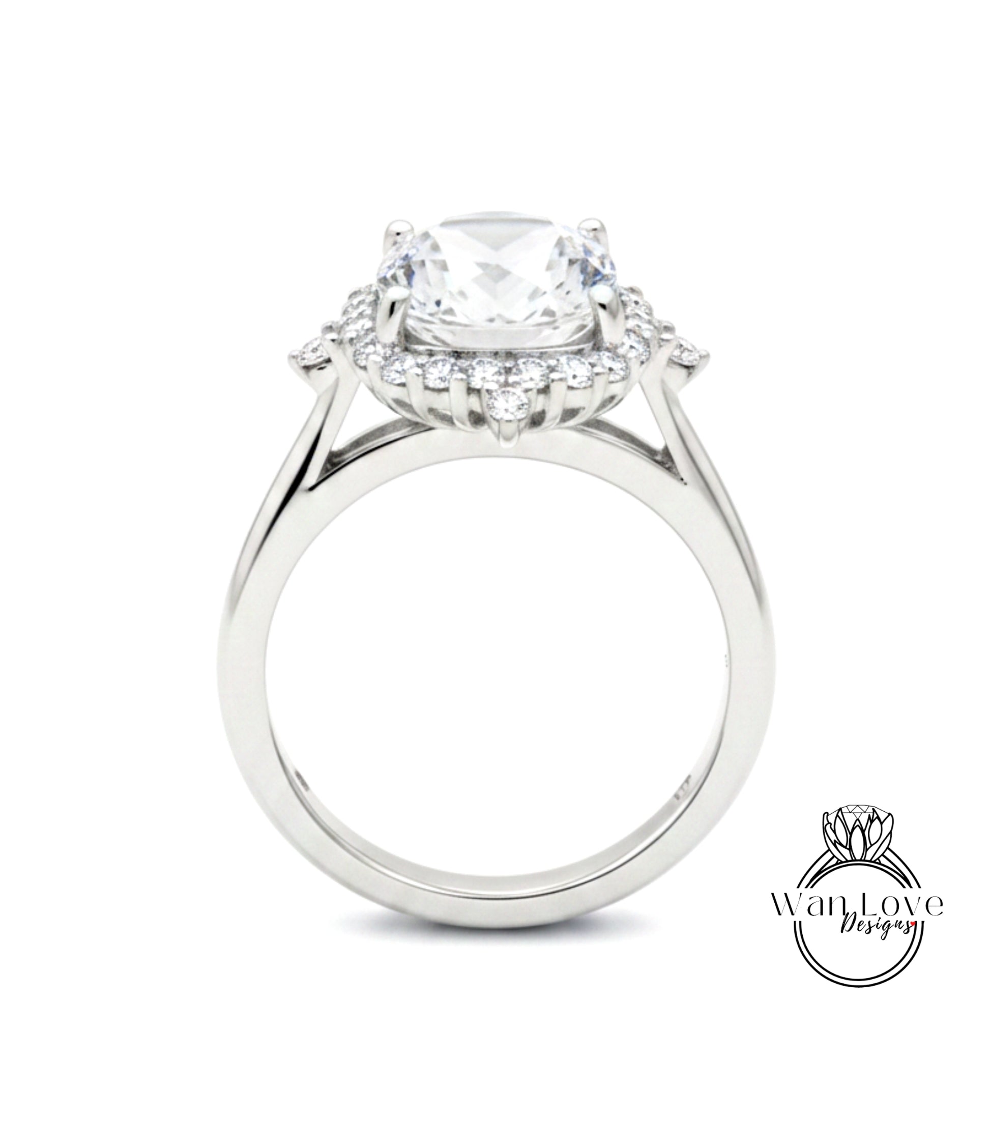 A close-up view of a silver engagement ring with a large central diamond surrounded by smaller diamonds.