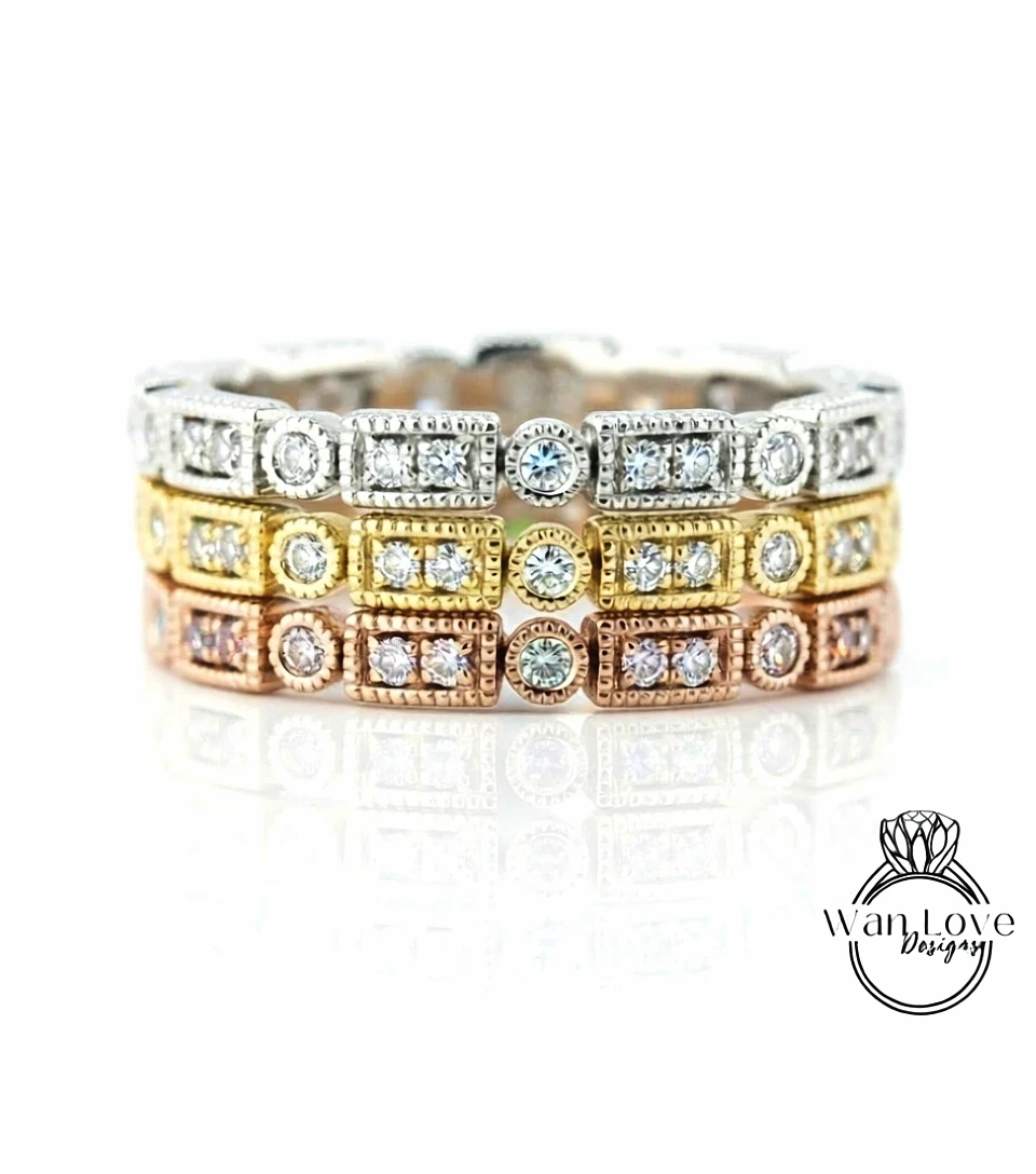 A close-up image of a ring with multiple layers of diamond-encrusted rings, showcasing the intricate design and craftsmanship.