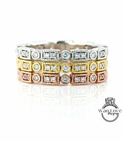 A close-up image of a ring with multiple layers of diamond-encrusted rings, showcasing the intricate design and craftsmanship.