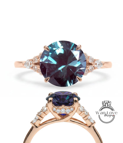 a beautiful engagement ring with a large blue gemstone set in a rose gold band. The ring is adorned with smaller diamonds around the band, adding to its elegance and sophistication.