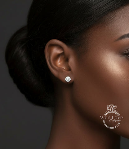 A close-up of a woman's ear with a diamond stud earring, showcasing the earring and the woman's face.