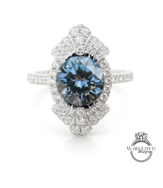 A stunning blue diamond ring with a large central gemstone surrounded by smaller diamonds, set in a silver band.