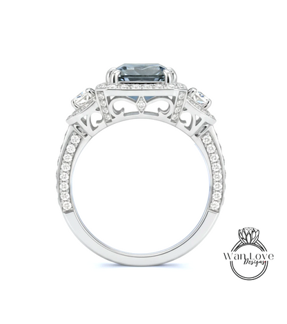 A silver ring with a large blue gemstone, surrounded by smaller diamonds and intricate designs.