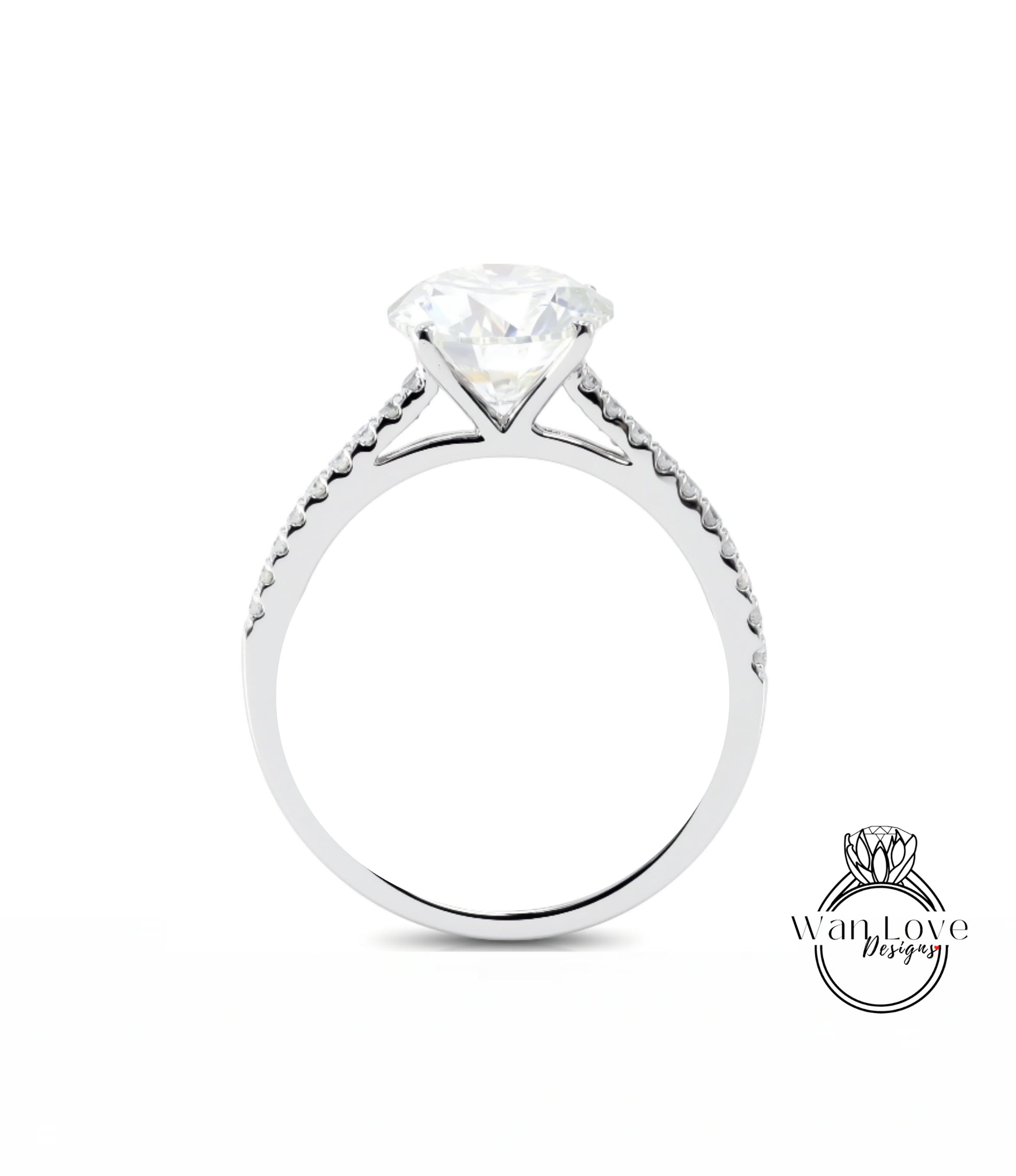 A silver engagement ring with a large diamond set in the center, surrounded by smaller diamonds along the band.