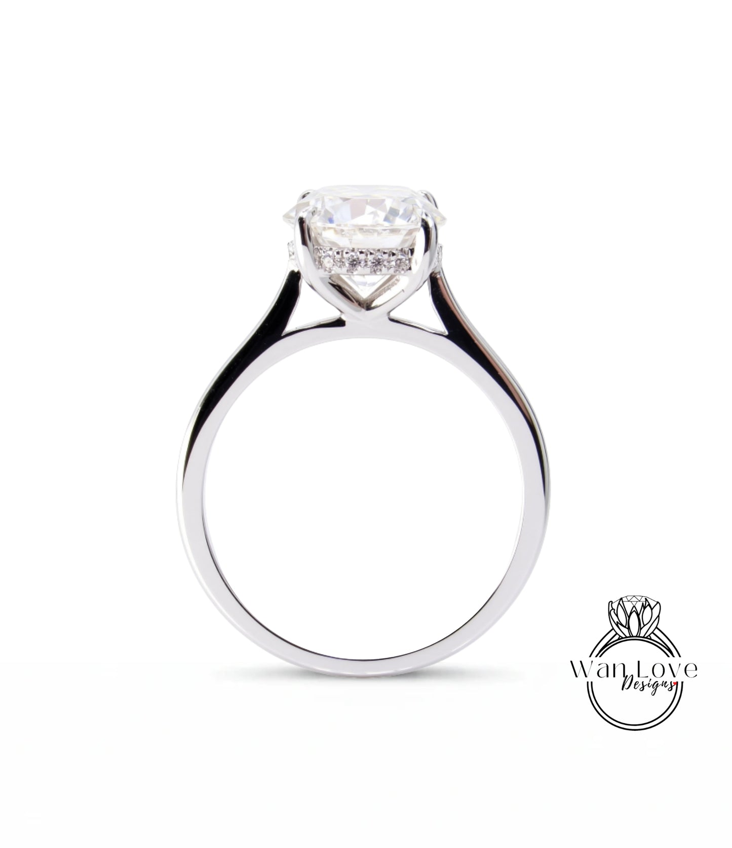A silver engagement ring with a large, clear gemstone set in the center of the band.