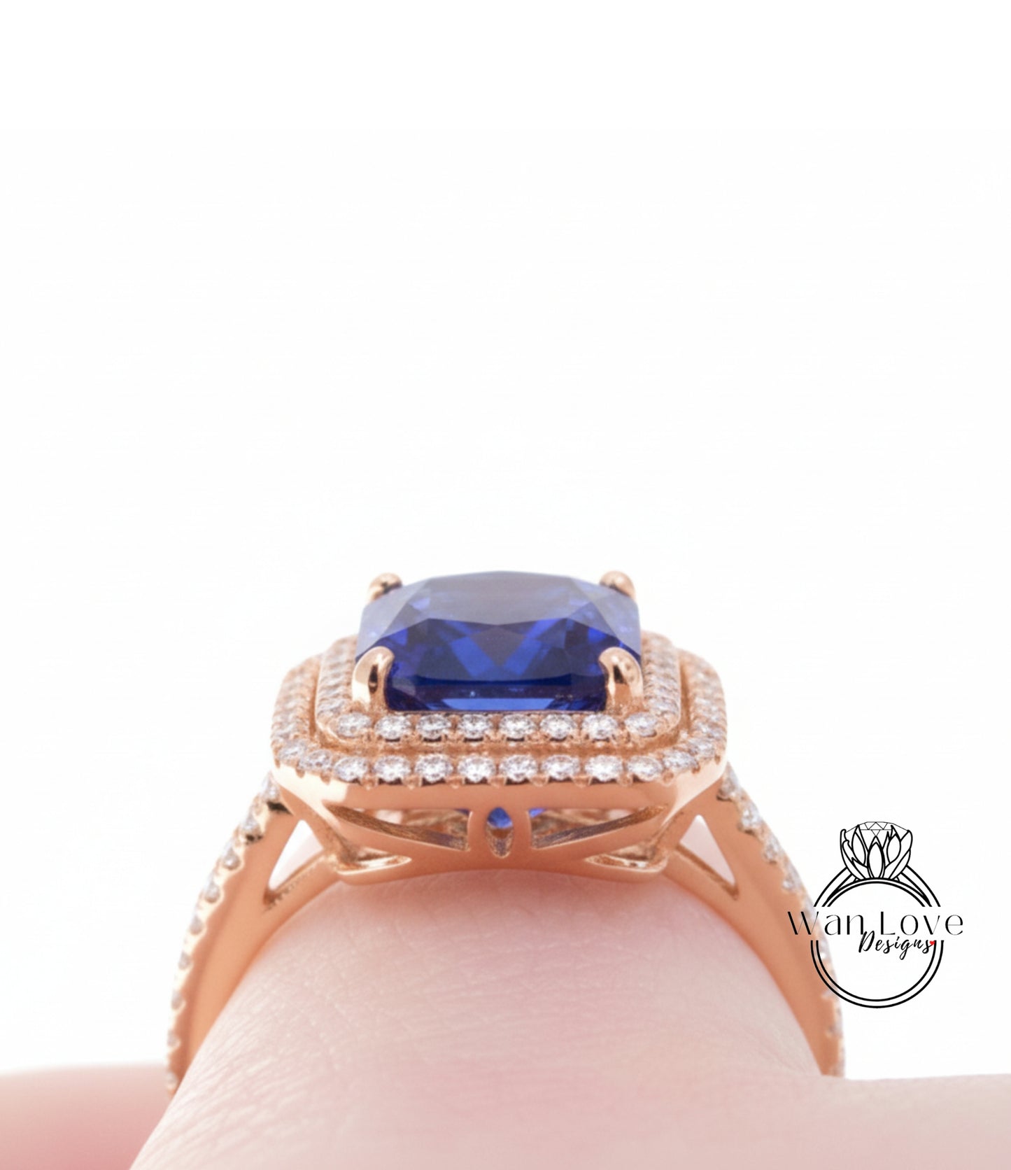 A close-up view of a gold ring with a large blue gemstone, showcasing the intricate design and craftsmanship.