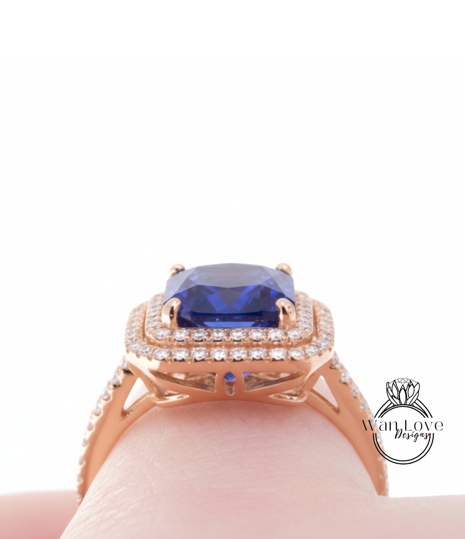 A close-up view of a gold ring with a large blue gemstone, showcasing the intricate design and craftsmanship.
