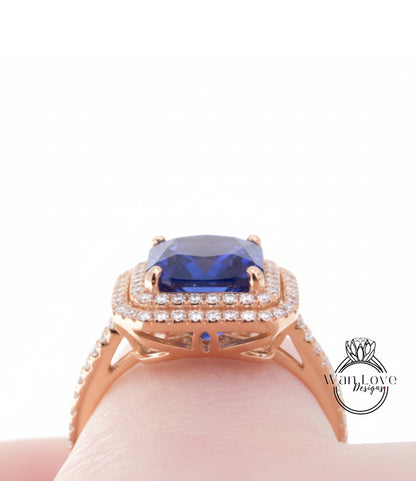 A close-up view of a gold ring with a large blue gemstone, showcasing the intricate design and craftsmanship.
