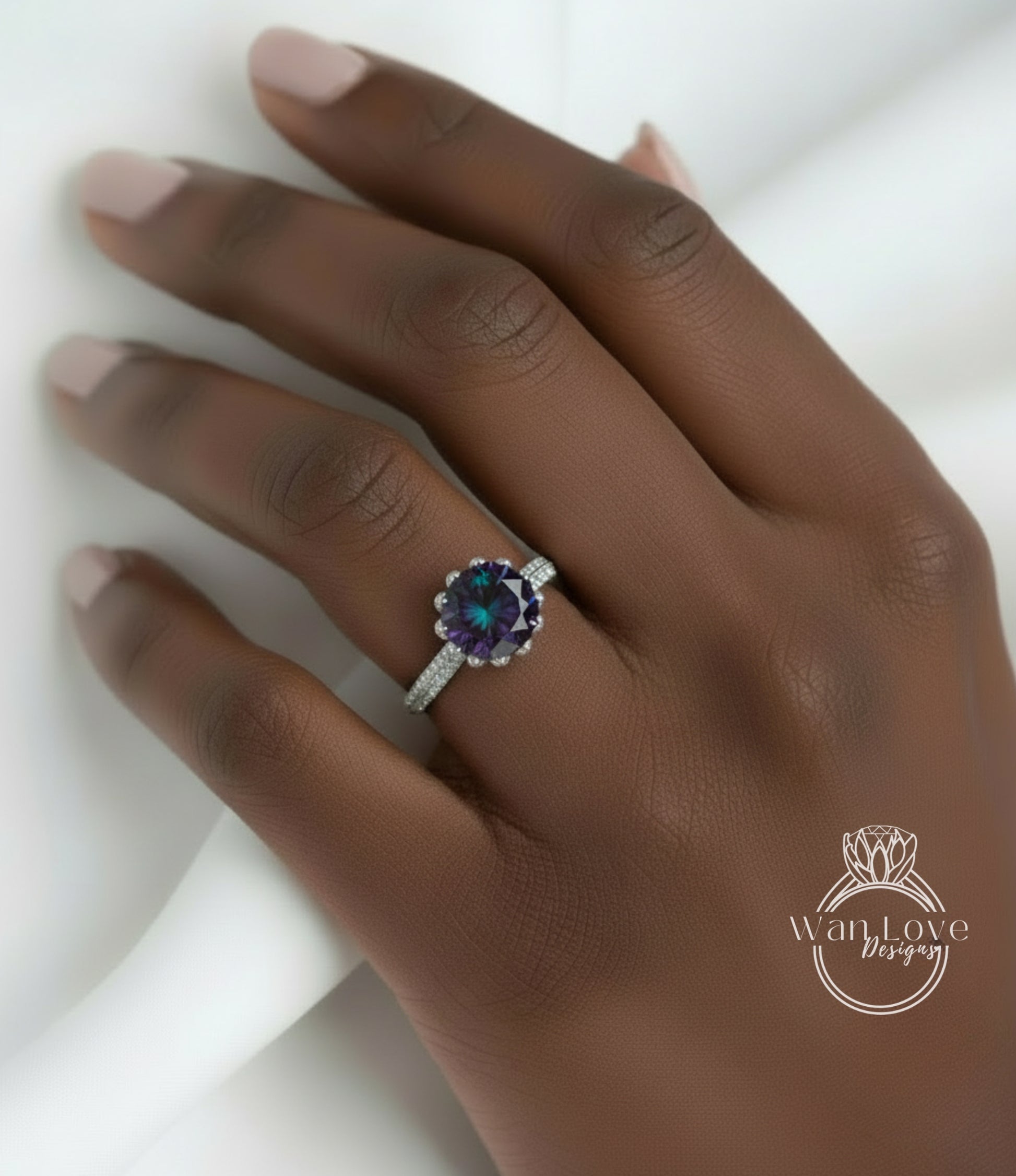 A close-up of a hand wearing a ring with a large, colorful gemstone.