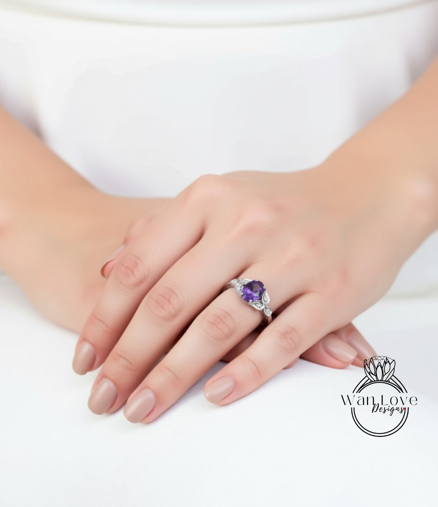 A close-up of a person's hand wearing a ring with a purple gemstone.