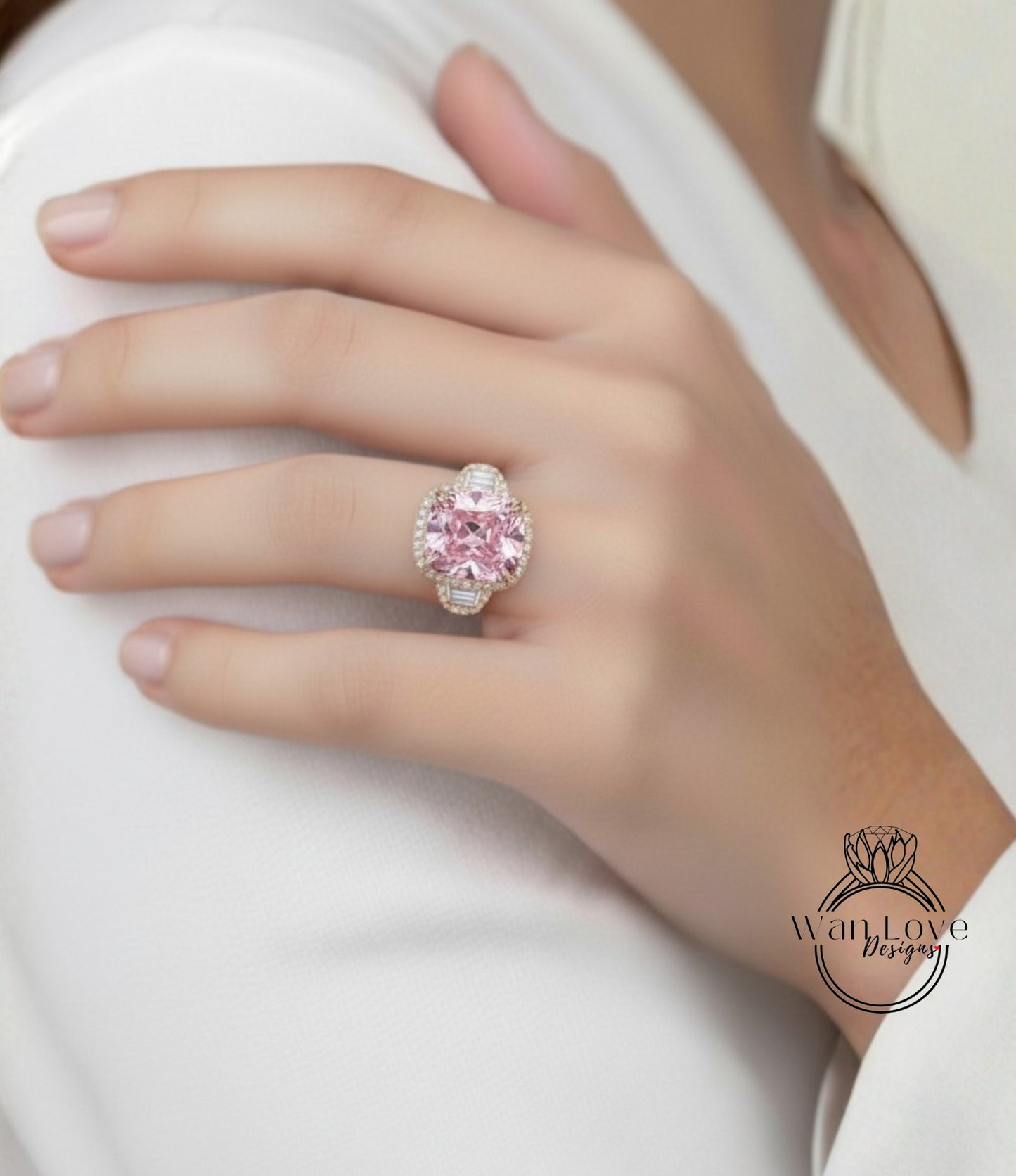 A close-up of a person's hand wearing a large, ornate ring with a pink gemstone.
