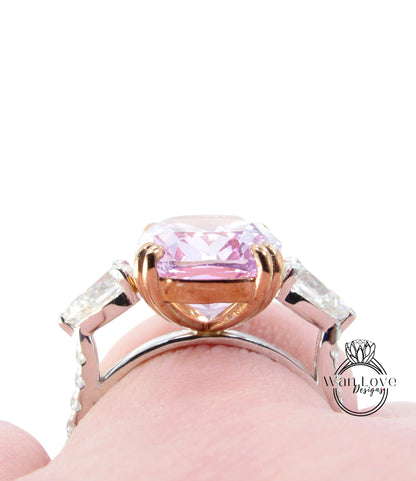 a ring with a pink stone in the middle of it