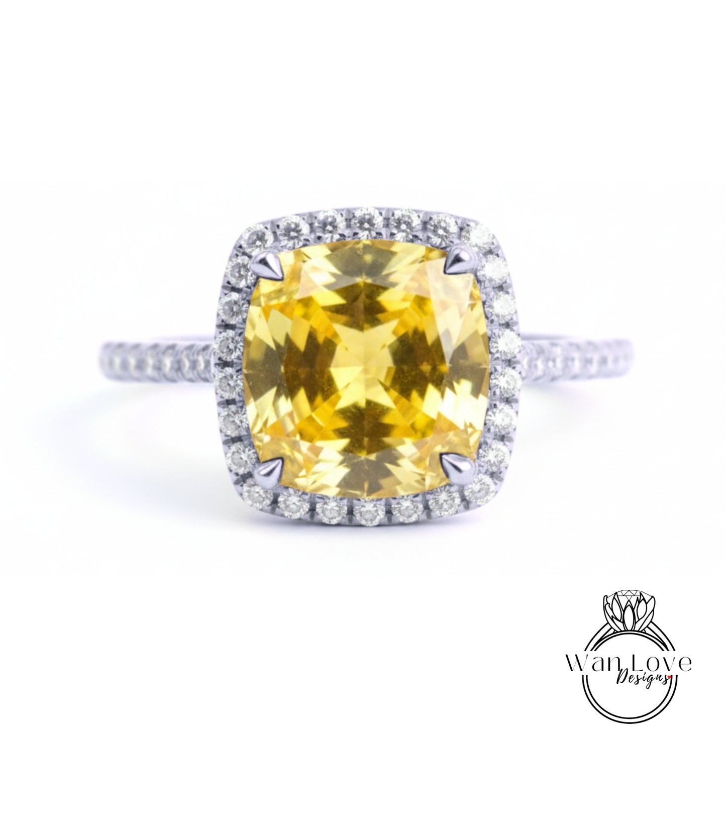 A large yellow gemstone ring with a halo of smaller diamonds around the center stone.