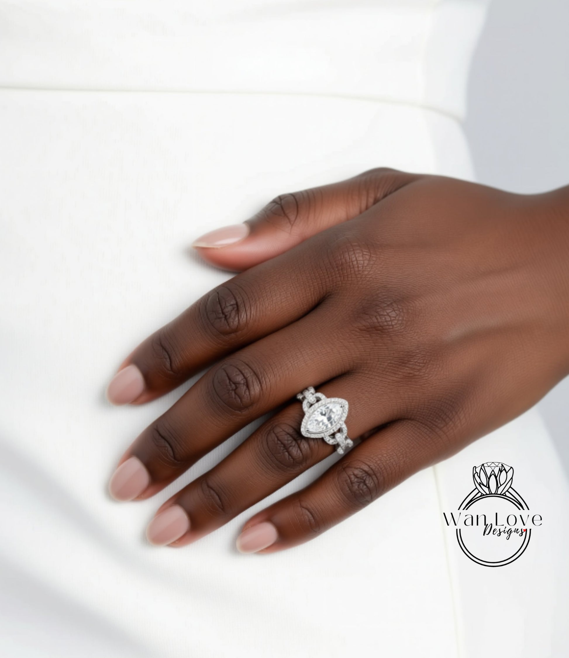 A close-up of a hand wearing a large diamond engagement ring.