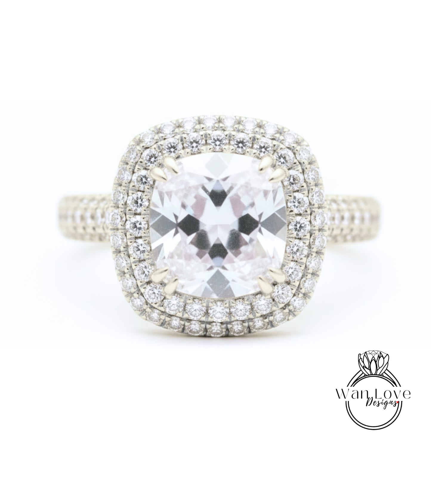 A diamond engagement ring with a large central gemstone surrounded by a halo of smaller diamonds set in a silver band.