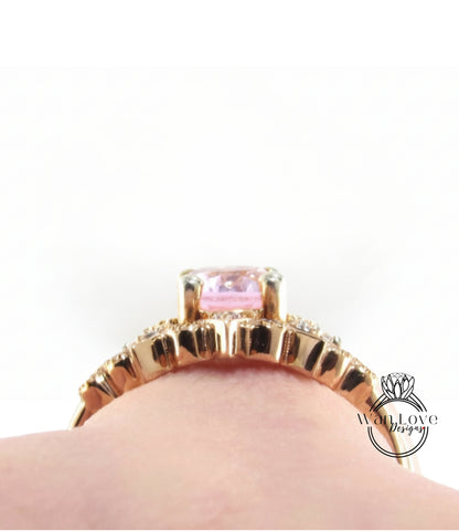 A close-up view of a gold ring with a pink gemstone, showcasing the intricate design and details of the jewelry piece.